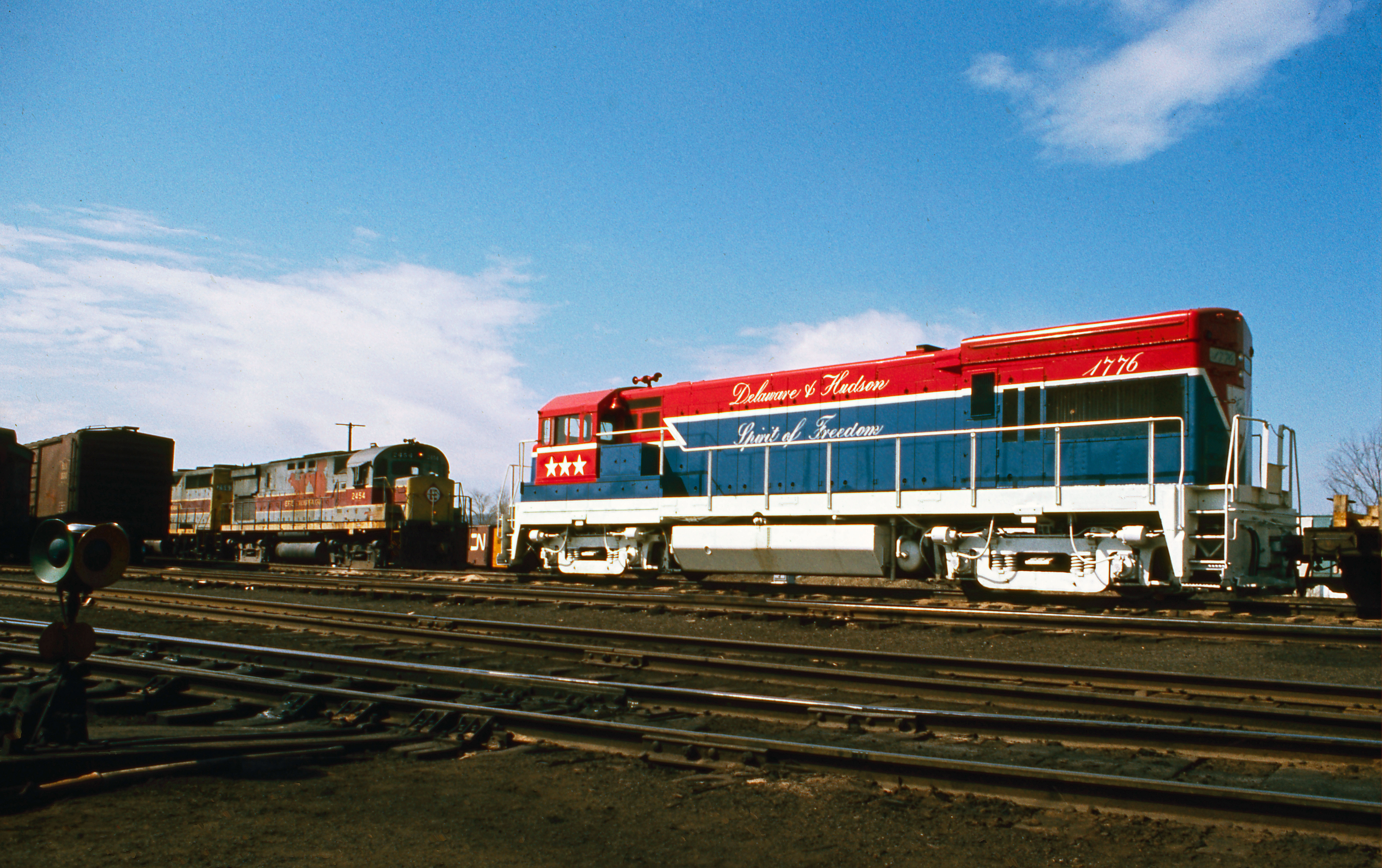 Going away view of April 10, 1975 D&H #OFX-1 with 1776, a high/wide extra for the Lehigh Valley at Sayre, Pa.    